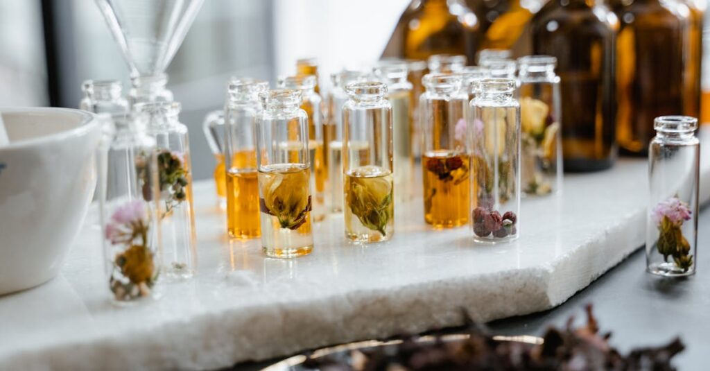 Close-up of various aromatic floral oils in glass bottles, showcasing their vibrant colors and natural ingredients.