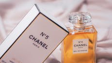 Chanel No.5 Eau de Parfum bottle and box beautifully displayed in a soft setting.